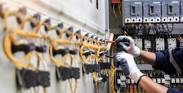 Professional Electrician technician working in Center Point, IA